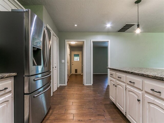 2916 Prairie Rose Ct, Oklahoma City, OK 73120 - kitchen featuring stainless steel fridge, dark wood finished floors, white cabinets, a textured ceiling, and recessed lighting