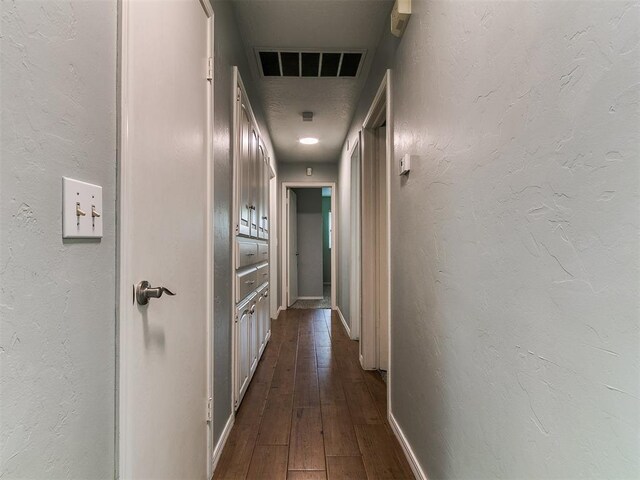 2916 Prairie Rose Ct, Oklahoma City, OK 73120 - hallway with baseboards and dark wood-style flooring