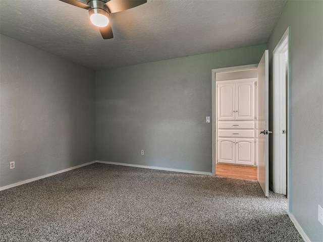 2916 Prairie Rose Ct, Oklahoma City, OK 73120 - carpeted spare room with ceiling fan, baseboards, and a textured ceiling