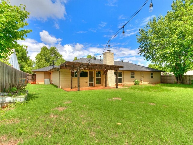 2916 Prairie Rose Ct, Oklahoma City, OK 73120 - rear view of house featuring a chimney, brick siding, a patio area, and roof with shingles