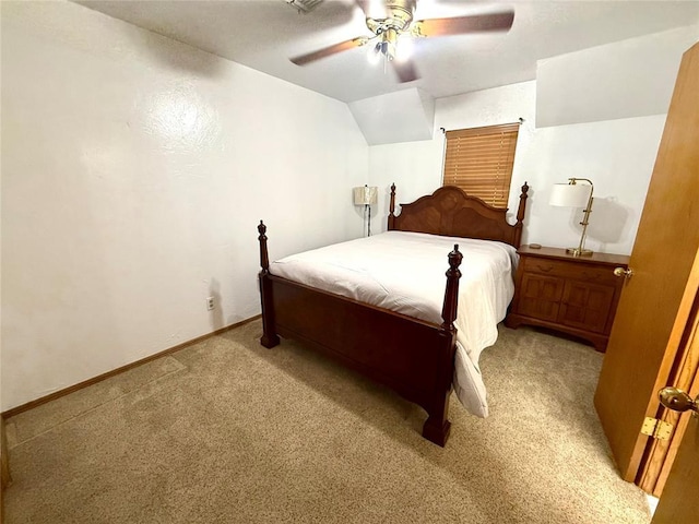 carpeted bedroom featuring a ceiling fan, vaulted ceiling, and baseboards