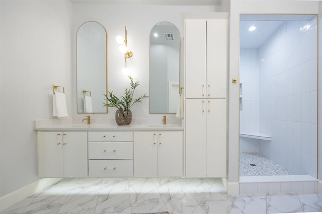 2101 NW 60th St, Oklahoma City, OK 73112 - full bath with marble look tiles, double vanity, a walk in shower, baseboards, and recessed lighting