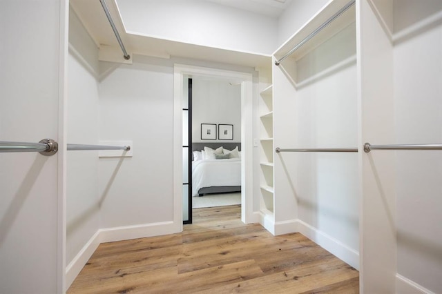 2101 NW 60th St, Oklahoma City, OK 73112 - walk in closet featuring light wood-style floors