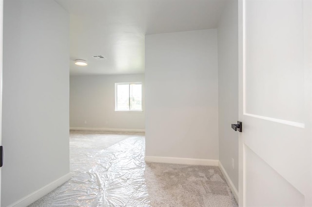 2101 NW 60th St, Oklahoma City, OK 73112 - corridor featuring light carpet and baseboards