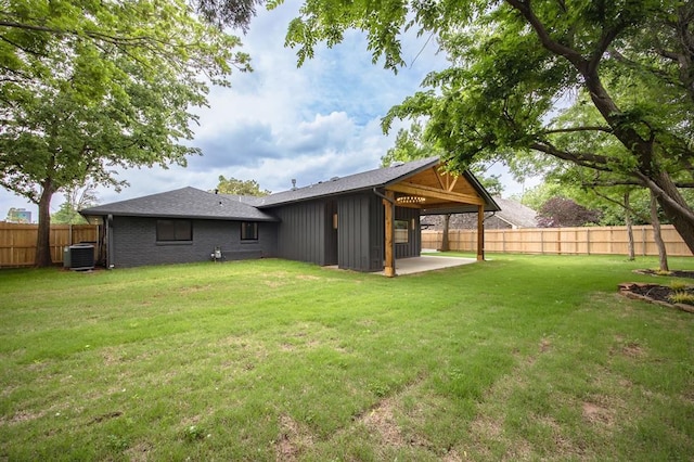 2101 NW 60th St, Oklahoma City, OK 73112 - back of property with a patio and central AC unit