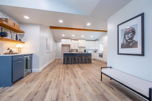 2101 NW 60th St, Oklahoma City, OK 73112 - living area featuring wine cooler, lofted ceiling, light wood-type flooring, wet bar, and recessed lighting