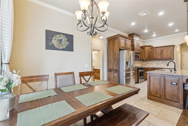 19724 Meadow Bend Ave, Edmond, OK 73012 - dining area with ornamental molding, a chandelier, arched walkways, recessed lighting, and light tile patterned floors