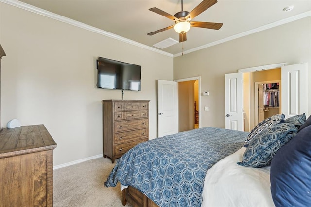 19724 Meadow Bend Ave, Edmond, OK 73012 - carpeted bedroom featuring crown molding, baseboards, ceiling fan, and a walk in closet