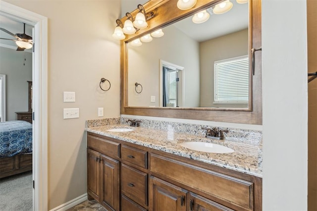 19724 Meadow Bend Ave, Edmond, OK 73012 - ensuite bathroom featuring a ceiling fan and double vanity