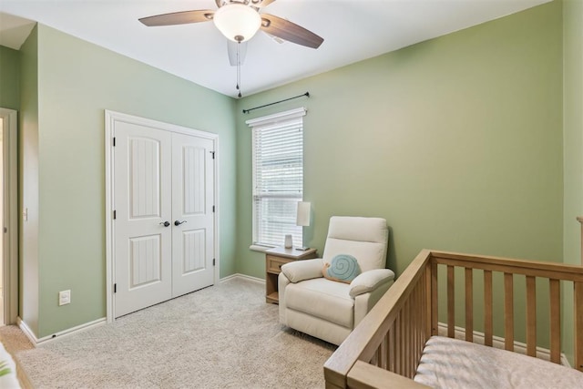 19724 Meadow Bend Ave, Edmond, OK 73012 - bedroom featuring carpet flooring, a closet, baseboards, and a ceiling fan