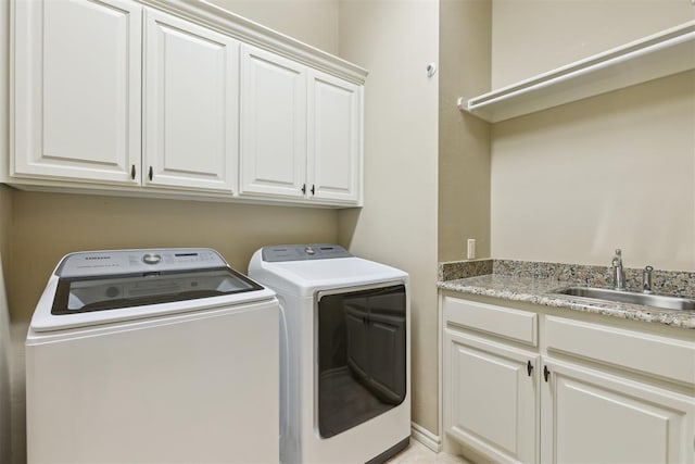 19724 Meadow Bend Ave, Edmond, OK 73012 - laundry area featuring cabinet space and washing machine and dryer