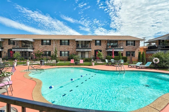 2525 NW 62nd St Unit 208, Oklahoma City, OK 73112 - community pool featuring a patio area