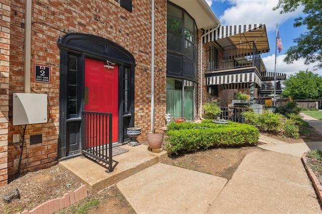 2525 NW 62nd St Unit 208, Oklahoma City, OK 73112 - view of exterior entry featuring brick siding