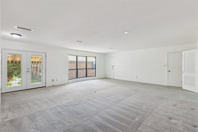 2525 NW 62nd St Unit 208, Oklahoma City, OK 73112 - carpeted spare room with french doors