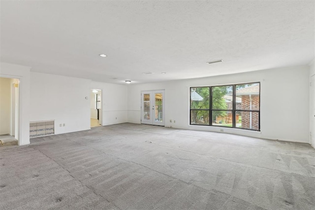 2525 NW 62nd St Unit 208, Oklahoma City, OK 73112 - carpeted spare room featuring french doors, recessed lighting, and baseboards
