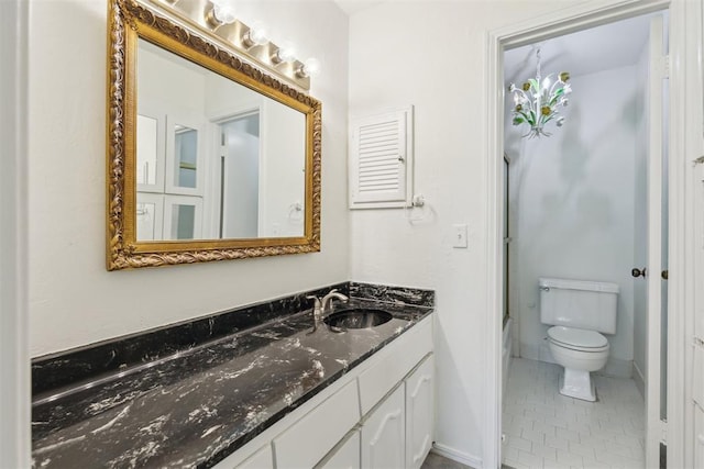 2525 NW 62nd St Unit 208, Oklahoma City, OK 73112 - bathroom featuring vanity, toilet, tile patterned flooring, and baseboards