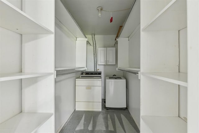 2525 NW 62nd St Unit 208, Oklahoma City, OK 73112 - laundry area with washer and dryer and cabinet space