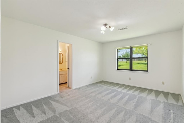2525 NW 62nd St Unit 208, Oklahoma City, OK 73112 - empty room featuring light colored carpet and baseboards