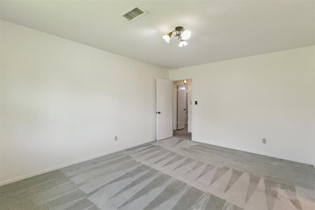 2525 NW 62nd St Unit 208, Oklahoma City, OK 73112 - empty room with light colored carpet and baseboards