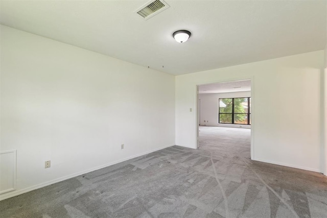 2525 NW 62nd St Unit 208, Oklahoma City, OK 73112 - empty room featuring carpet and baseboards