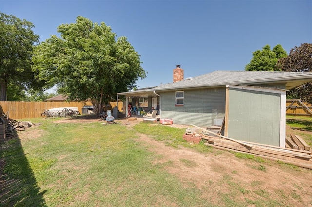 9801 Lancet Ln, Oklahoma City, OK 73120 - back of property with a chimney and brick siding