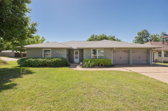 9801 Lancet Ln, Oklahoma City, OK 73120 - ranch-style home featuring an attached garage, a front lawn, driveway, and brick siding
