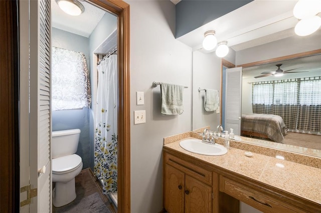 9801 Lancet Ln, Oklahoma City, OK 73120 - full bath featuring vanity, connected bathroom, ceiling fan, and tile patterned flooring