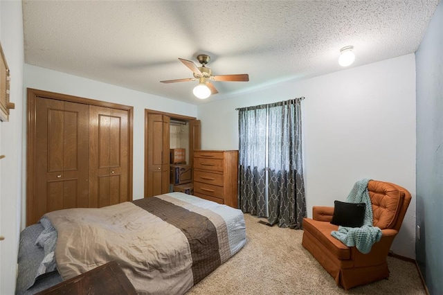 9801 Lancet Ln, Oklahoma City, OK 73120 - bedroom with light colored carpet, multiple closets, and ceiling fan