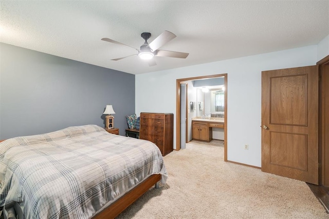 9801 Lancet Ln, Oklahoma City, OK 73120 - bedroom with light carpet, a ceiling fan, a textured ceiling, and connected bathroom