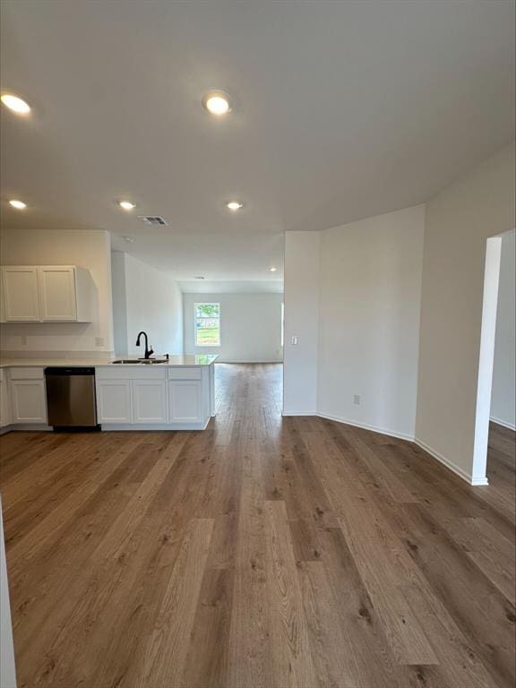 866 SW 11th St, Newcastle, OK 73065 - unfurnished living room with a sink, light wood-style flooring, recessed lighting, and baseboards