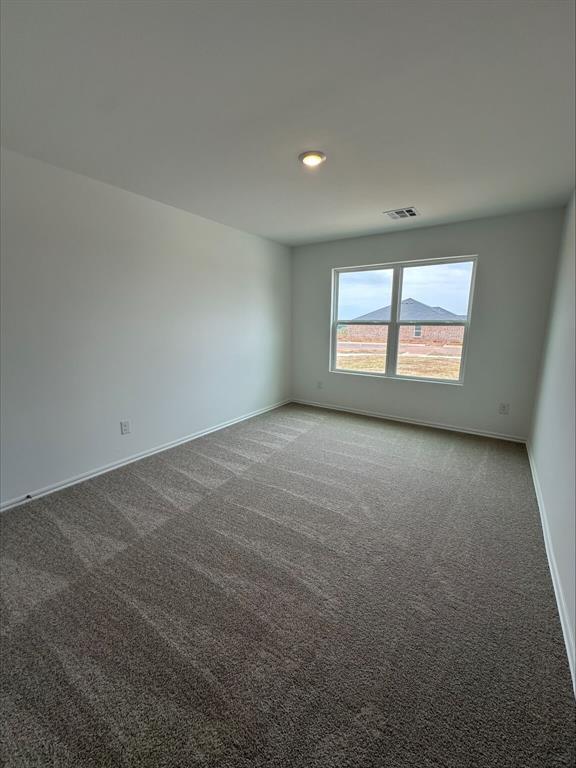 866 SW 11th St, Newcastle, OK 73065 - spare room featuring carpet flooring and baseboards