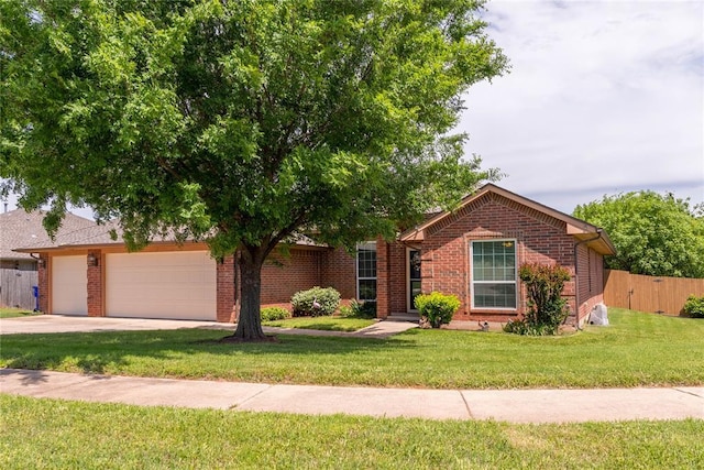 3305 Tecumseh Meadows Way, Norman, OK 73069 - view of front of home featuring brick siding, driveway, and an attached garage
