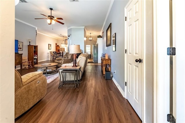 3305 Tecumseh Meadows Way, Norman, OK 73069 - living area with crown molding, dark wood-type flooring, a ceiling fan, and baseboards