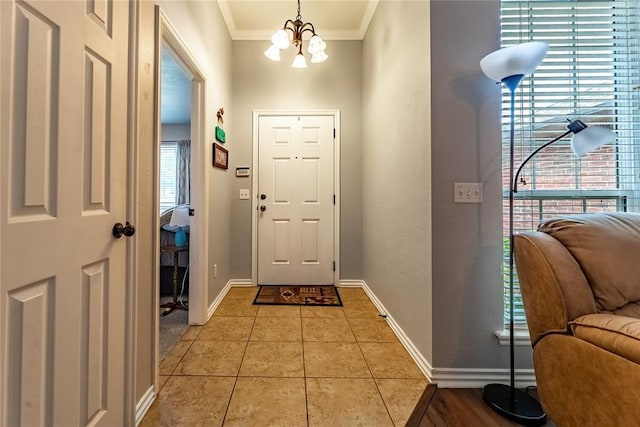 3305 Tecumseh Meadows Way, Norman, OK 73069 - foyer with a chandelier, baseboards, crown molding, and light tile patterned floors