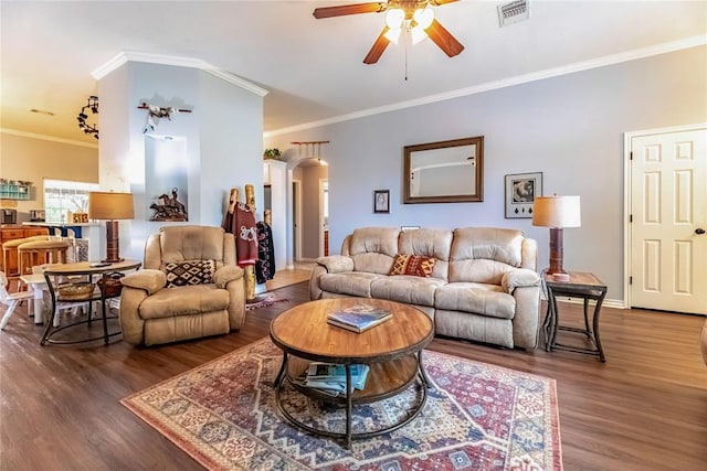 3305 Tecumseh Meadows Way, Norman, OK 73069 - living room with arched walkways, a ceiling fan, wood finished floors, ornamental molding, and baseboards