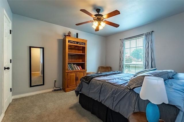 3305 Tecumseh Meadows Way, Norman, OK 73069 - bedroom featuring light colored carpet, ceiling fan, and baseboards