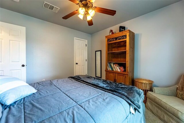 3305 Tecumseh Meadows Way, Norman, OK 73069 - bedroom with a ceiling fan and carpet