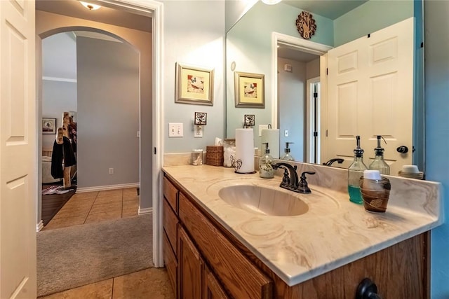 3305 Tecumseh Meadows Way, Norman, OK 73069 - bathroom featuring tile patterned floors, vanity, and baseboards