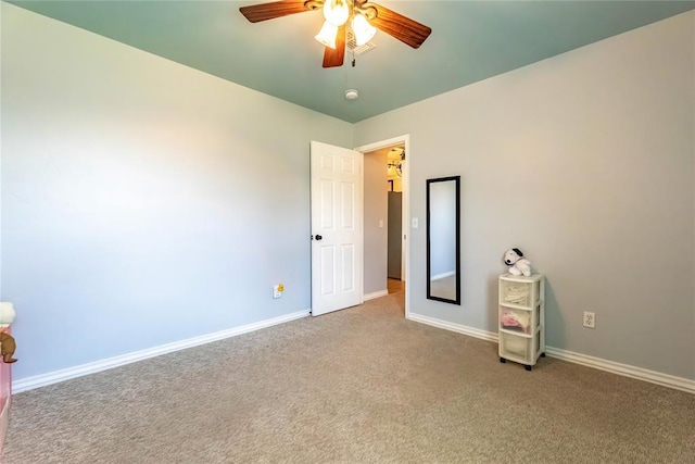 3305 Tecumseh Meadows Way, Norman, OK 73069 - unfurnished bedroom with carpet, baseboards, and a ceiling fan