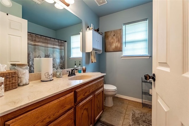 3305 Tecumseh Meadows Way, Norman, OK 73069 - bathroom with tile patterned flooring, vanity, toilet, baseboards, and a shower with curtain