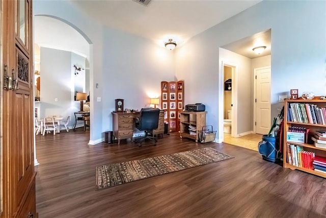 3305 Tecumseh Meadows Way, Norman, OK 73069 - home office with arched walkways, wood finished floors, and baseboards