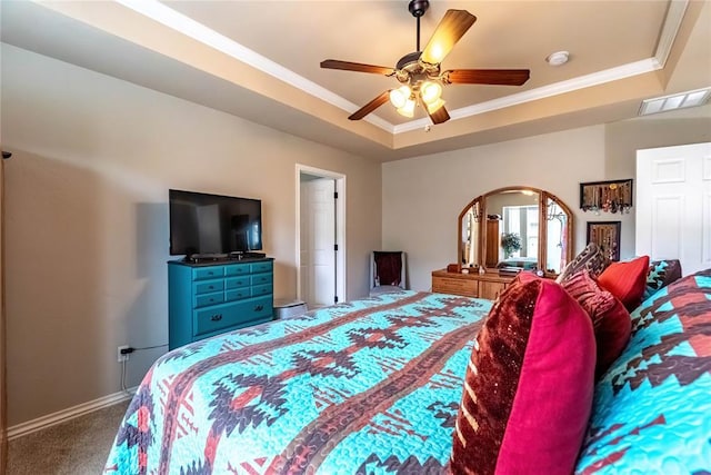 3305 Tecumseh Meadows Way, Norman, OK 73069 - carpeted bedroom with a raised ceiling, ornamental molding, baseboards, a ceiling fan, and arched walkways