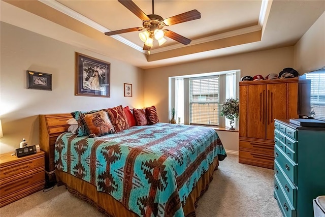 3305 Tecumseh Meadows Way, Norman, OK 73069 - bedroom featuring crown molding, light colored carpet, a raised ceiling, and a ceiling fan