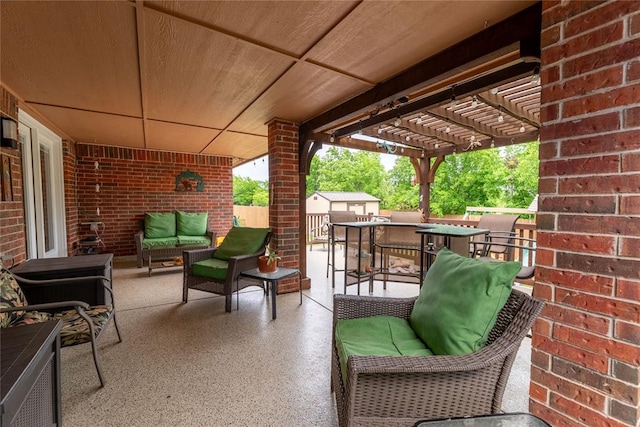 3305 Tecumseh Meadows Way, Norman, OK 73069 - view of patio / terrace with an outdoor living space, a storage shed, a pergola, and an outbuilding