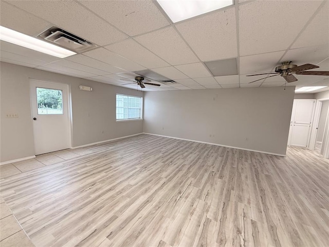 312 N 6th St, Amber, OK 73004 - spare room with light wood-style floors, a ceiling fan, baseboards, and a paneled ceiling