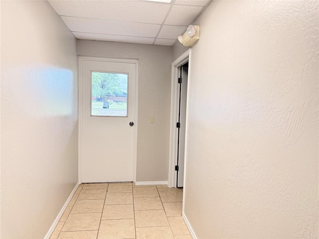 312 N 6th St, Amber, OK 73004 - corridor featuring light tile patterned flooring, a paneled ceiling, and baseboards