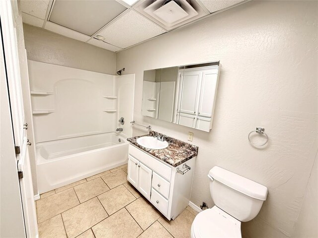 312 N 6th St, Amber, OK 73004 - bathroom with toilet, bathing tub / shower combination, vanity, tile patterned flooring, and a drop ceiling