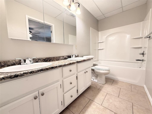 312 N 6th St, Amber, OK 73004 - full bathroom featuring a paneled ceiling, toilet, double vanity, bathing tub / shower combination, and tile patterned floors