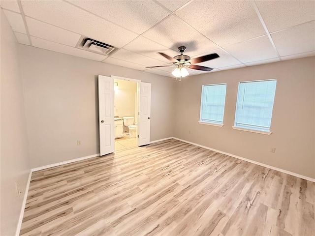 312 N 6th St, Amber, OK 73004 - empty room featuring a paneled ceiling, a ceiling fan, light wood-type flooring, and baseboards
