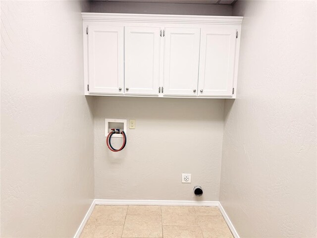312 N 6th St, Amber, OK 73004 - laundry area with baseboards, hookup for a washing machine, cabinet space, electric dryer hookup, and tile patterned floors